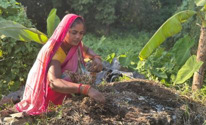 Ram Kumari preparing compost using cow dung and dry matter 
