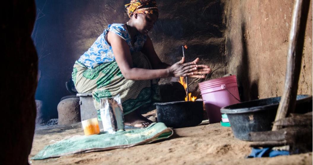 A woman prepares a meal in their home.